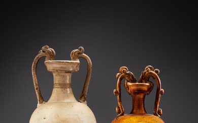 Two pottery 'amphora' vases, Tang dynasty | 唐 白釉及黃釉雙龍耳尊一組兩件