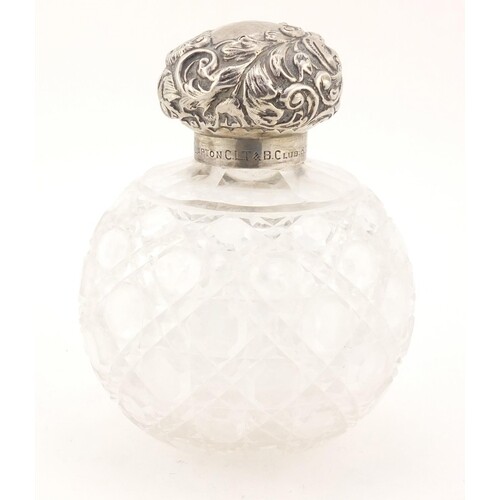 Victorian cut glass scent bottle with silver lid, by James D...