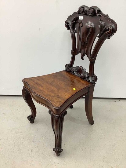 Victorian mahogany hall chair with pierced carved shield shape back on cabriole front legs