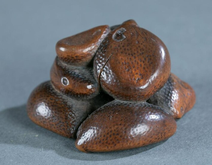 Wood netsuke of a group of nuts, 19th century.