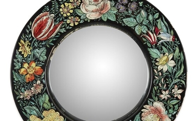 A Fornasetti "Bullseye" mirror Decorated with a floral border,...