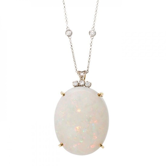 18kt yellow gold claw set opal pendant with 18kt white gold chain and diamonds.