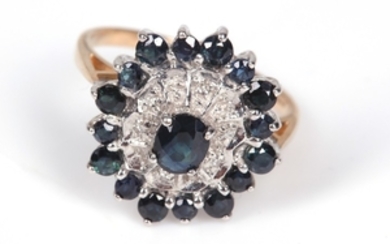 A sapphire and diamond cluster ring, mounted in...