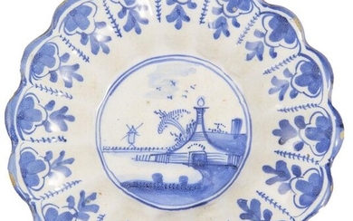 45- Holland: small gadrooned dish with blue monochrome landscape decoration....