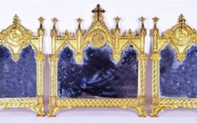 A decorative ecclesiastic gilt-metal framed mirror tryptic in the manner of A.W.N Pugin the central panel with a central...
