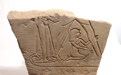 An Egyptian sandstone relief depicting a boat scene