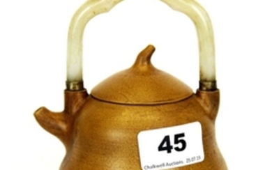 A pale Chinese Yixing terracotta teapot with white jade handle, H. 14cm.