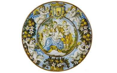 Plate Wide brimmed plate with wide cavetto. Recto: majolica painted...