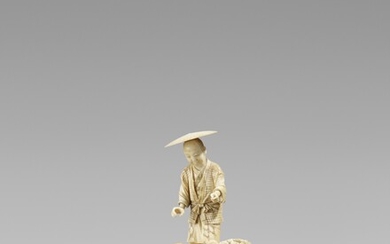 An ivory okimono of a fisherman. Late 19th century