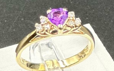 A 14ct gold amethyst and diamond shoulders with a heart shap...