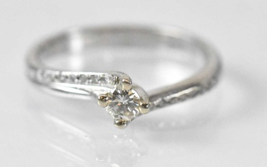 A 14ct white gold diamond solitaire ring, the central stone...