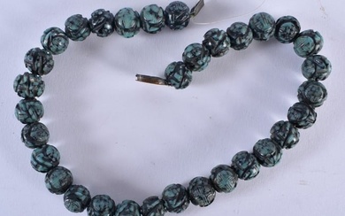 A 19TH CENTURY CHINESE CARVED TURQUOISE NECKLACE Qing. 73 grams. 34 cm long.