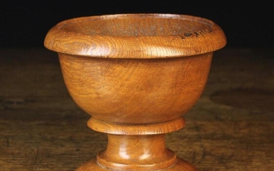 A 19th Century Turned Elm Master Salt with everted rim, a scotia moulded stem and round foot, 5½'' (