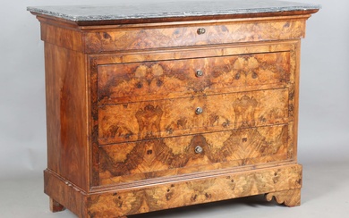 A 19th century French burr walnut four-drawer commode with a grey marble top and gilt brass handles
