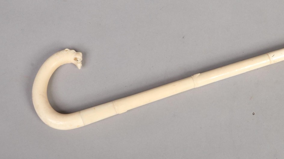 A 19th century Indian carved ivory faux bamboo walking stick...