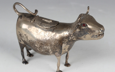 A 20th century Dutch silver cow creamer, modelled standing with tail curling up to form the handle