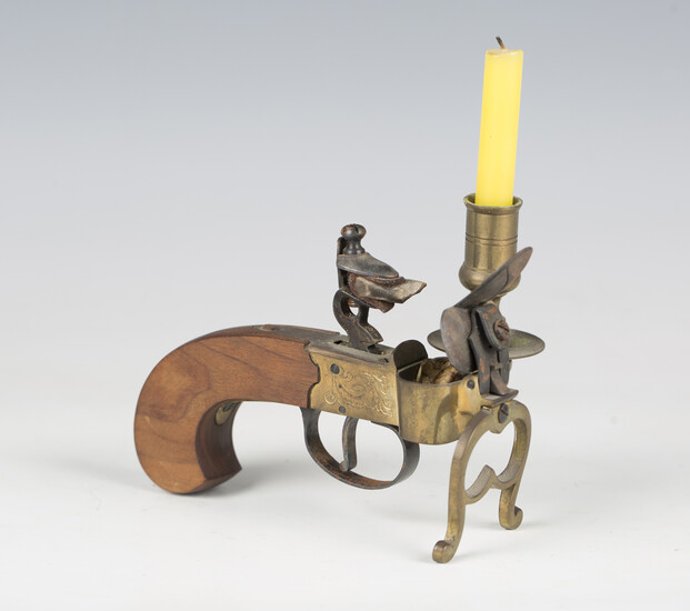A 20th century Italian pistol tinder lighter with wooden handle and candle socket, length 13cm.