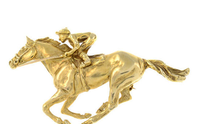 A 9ct gold jockey and horse brooch.