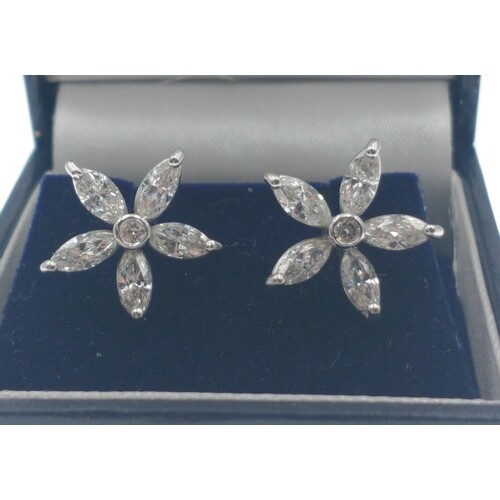 A BEAUTIFUL A pair of 18ct white and diamond flower shaped e...