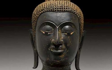 A BRONZE HEAD OF BUDDHA.