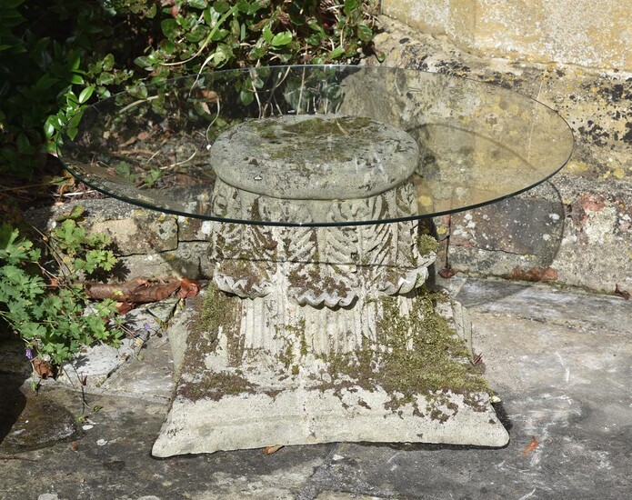A CARVED LIMESTONE AND GLASS OCCASIONAL TABLE, LATE 19TH/20TH CENTURY