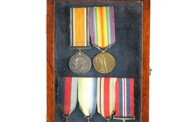 A CASED GROUP OF 1ST AND 2ND WORLD WAR MEDALS awarded to 218...