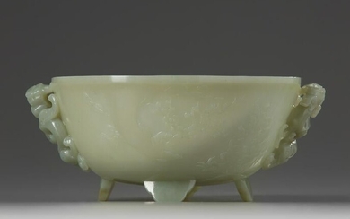 A CHINESE CELADON JADE 'POETIC' TWIN HANDLED BOWL