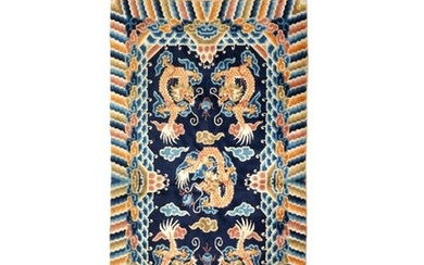 A CHINESE 'FIVE DRAGON' RUG LATE QING DYNASTY/REPUBLIC PERIOD Decorated...