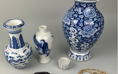 A COLLECTION OF CHINESE BLUE AND WHITE VASES, A TEA CUP, A B...