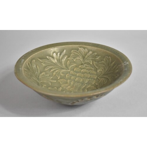 A Chinese Celadon Glazed Bowl Decorated in Shallow Relief wi...
