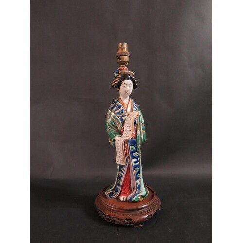 A Chinese Famille Vert Porcelain Female Figural Lamp holding...