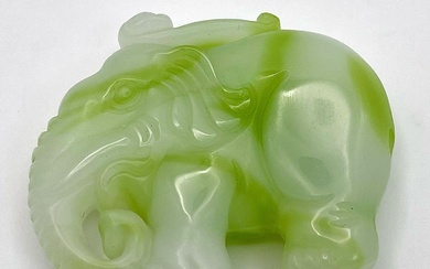 A Chinese Green and White Jade Elephant Figurine Pendant....