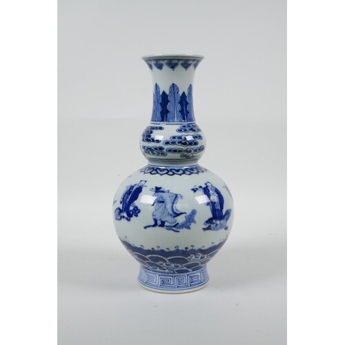 A Chinese blue and white porcelain double gourd vase decorat...