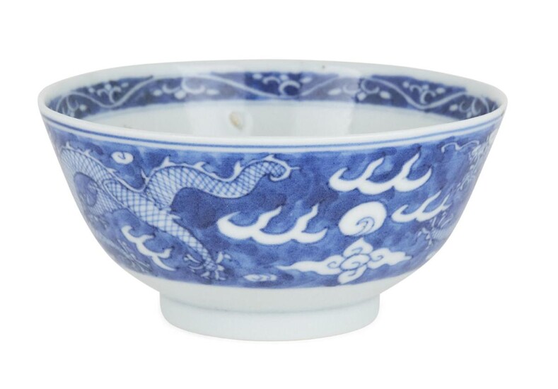 A Chinese blue and white porcelain 'dragon' bowl, Republic period, painted to the exterior with two five-clawed dragons chasing flaming pearls, the interior with another dragon and flaming pearl, underglaze blue four-character mark within double...