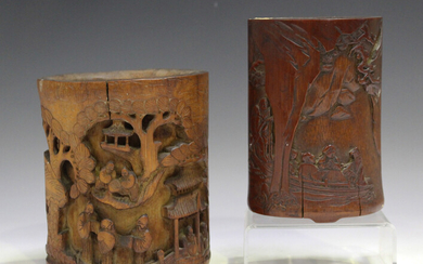 A Chinese carved bamboo brush pot, Qing dynasty, carved in relief with six figures in a boat passing