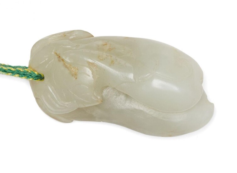A Chinese pale green jade pendant, 19th century, carved as...