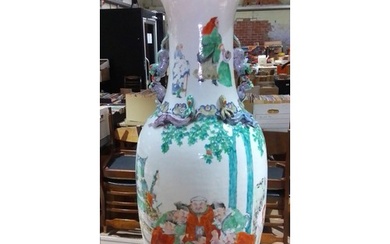 A Chinese porcelain vase, decorated in over enamels, dog han...