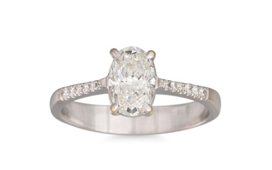 A DIAMOND SOLITAIRE RING, the oval brilliant cut diamond mou...