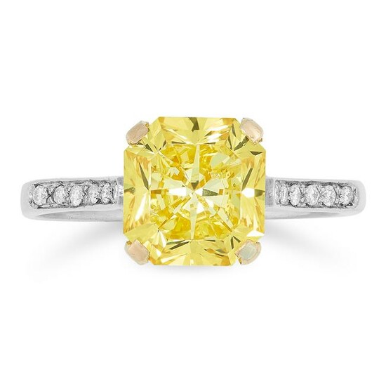 A FANCY VIVID YELLOW DIAMOND RING set with a cut