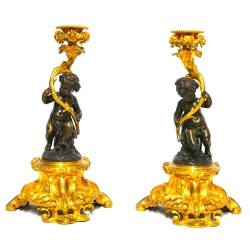 A FINE AND IMPRESSIVE PAIR OF 19TH CENTURY GILT AND PATINATE...