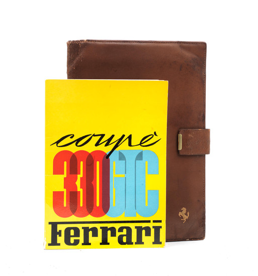 A Ferrari 330 GTC Coupe owner's manual with leather wallet