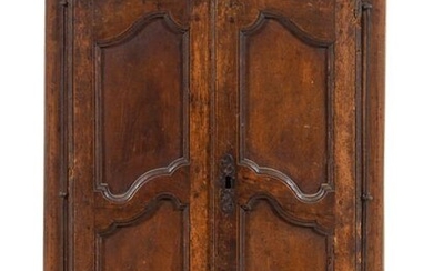 A French Provincial Carved Walnut Diminutive Armoire