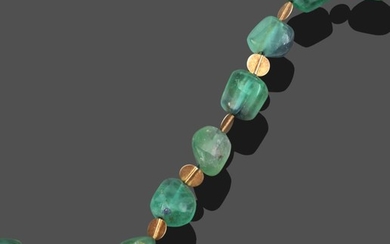 A Green Tourmaline Necklace, by Charmian Ottaway, irregular shaped green...