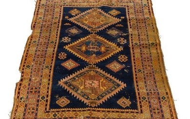 A Heriz rug, with three medallions in...