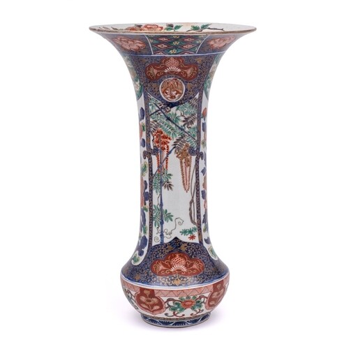 A Japanese Imari sleeve vase: painted with underglaze blue b...