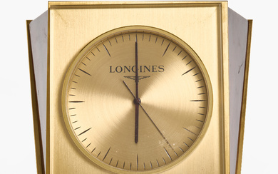 A Longines table clock, brass and lacquered wood.