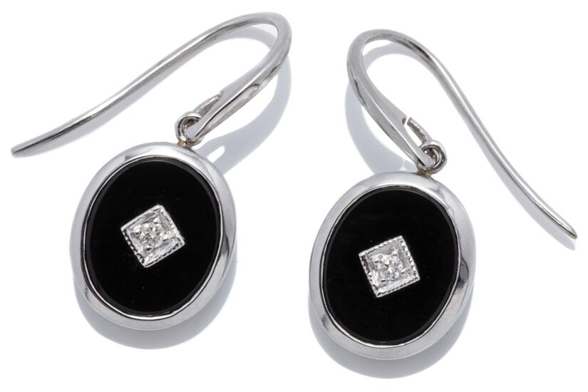 A PAIR OF DECO STYLE ONYX AND DIAMOND EARRINGS; each a 9ct white gold framed oval onyx plaque centring a round brilliant cut diamond...