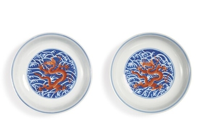 A PAIR OF FINE IRON-RED AND UNDERGLAZE-BLUE 'DRAGON' DISHES, QIANLONG SEAL MARKS AND PERIOD