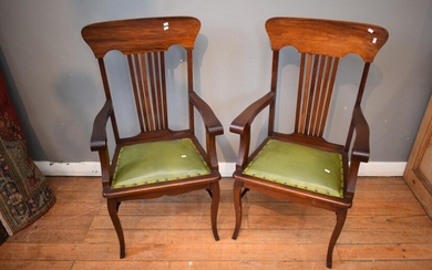 A PAIR OF LEATHER SEATED CARVERS (108H X 59W X 50D CM)
