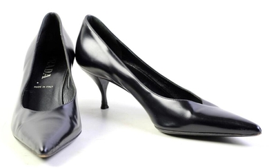 A PAIR OF PRADA BLACK LEATHER PUMPS; pointed toe with kitten heel, size 38, wear and dents.